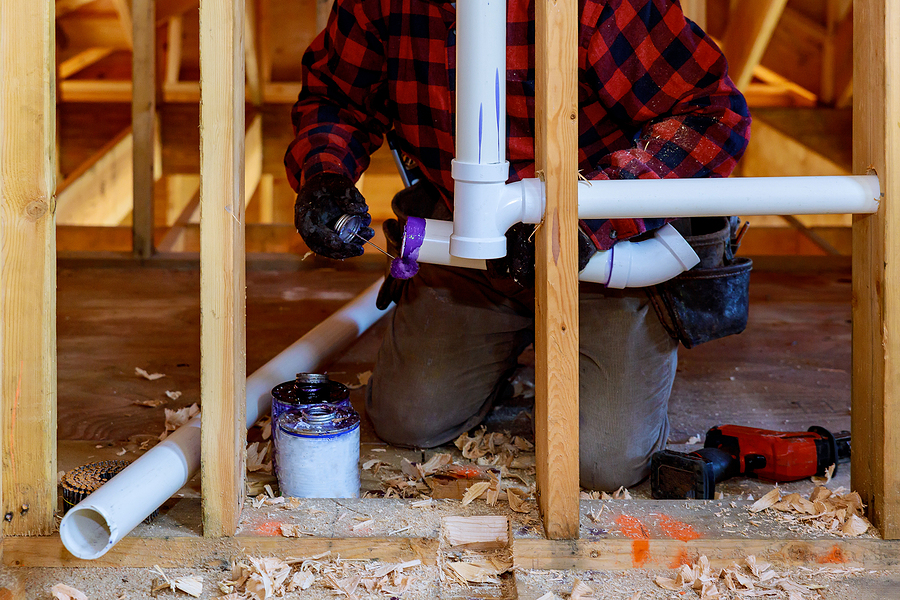 man attaching the pipe